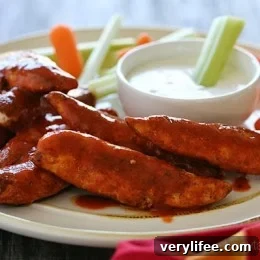 Quick and easy – these buffalo chicken strips are spicy and delicious! I like to serve them with my homemade skinny blue cheese dressing and celery sticks on the side for a hot and spicy appetizer.