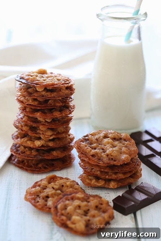 These delicious dark chocolate oatmeal lace cookies are light, crisp and chewy, sandwiched together with melted dark chocolate.