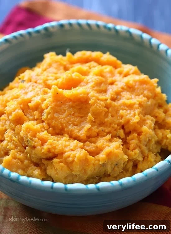 A savory slow cooker garlic mashed sweet potatoes recipe that's the perfect addition to your turkey dinner – let your slow cooker help you out in the kitchen this Thanksgiving!