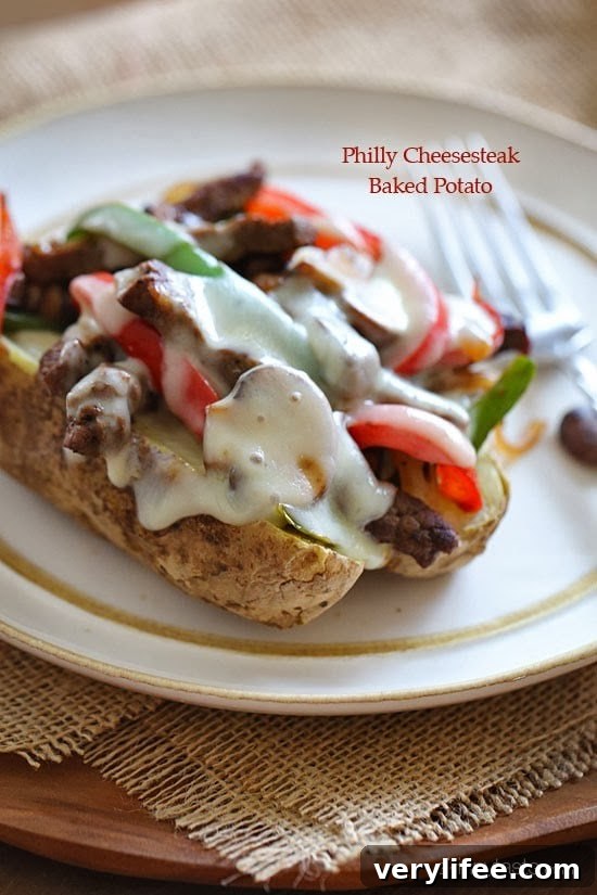 Steak, onions and peppers on a baked potato