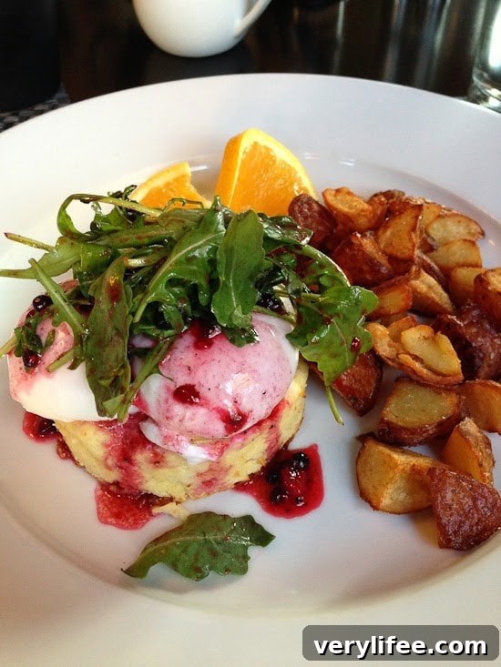 Broiled Wild Salmon with Cherry-Apple Chutney Recipe 11 Poached eggs over souffle with arugula salad and berry dressing, a side of roasted potato chunks, and orange slices