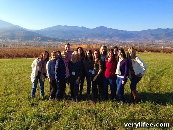 Broiled Wild Salmon with Cherry-Apple Chutney Recipe 7 A group of friends in a field with fall foliage and mountains behind them