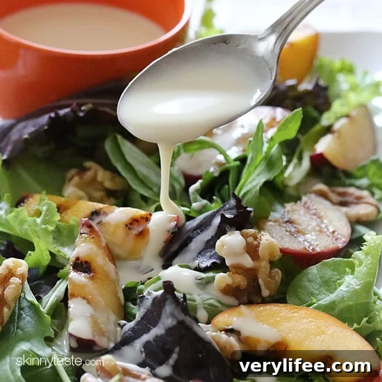 Grilled stone fruit like peaches and plums served over baby greens with walnuts and a sweet honey goat cheese dressing, this salad is light and delicious!