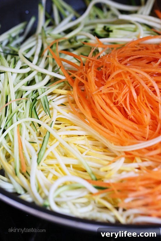 Sauteed Julienned Summer Vegetables Recipe 3 Zucchini, yellow squash and carrots cut into spaghetti like strands and sauteed with garlic and oil.