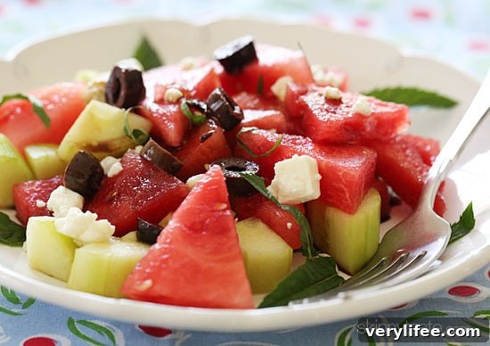 Chilled Watermelon, Cucumber and Feta Salad Recipe 2 Salad with chilled watermelon and chunks of cucumber are tossed with feta cheese, Kalamata olives, fresh mint and a drizzle of balsamic glaze.