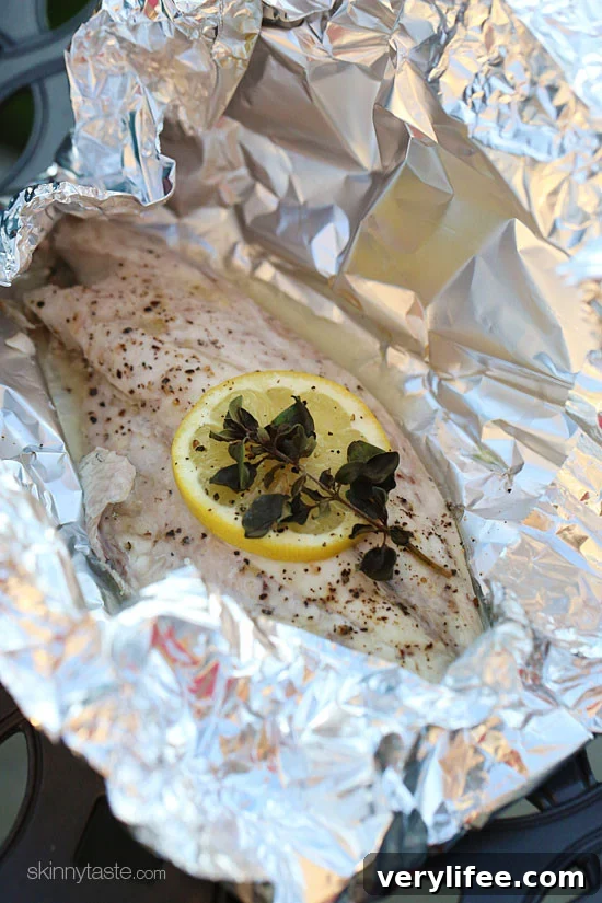 Grilled fish in foil packets ready to serve