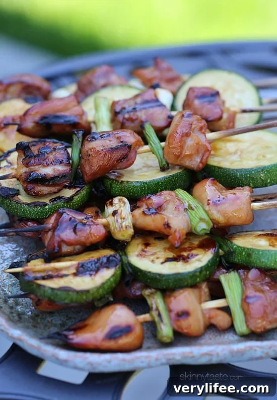 Japanese Chicken Yakitori Skewers Recipe 4 Grilled Chicken and Zucchini Yakitori – Japanese inspired grilled chicken and zucchini skewers marinated with yakitori sauce and threaded onto bamboo sticks with green onions.