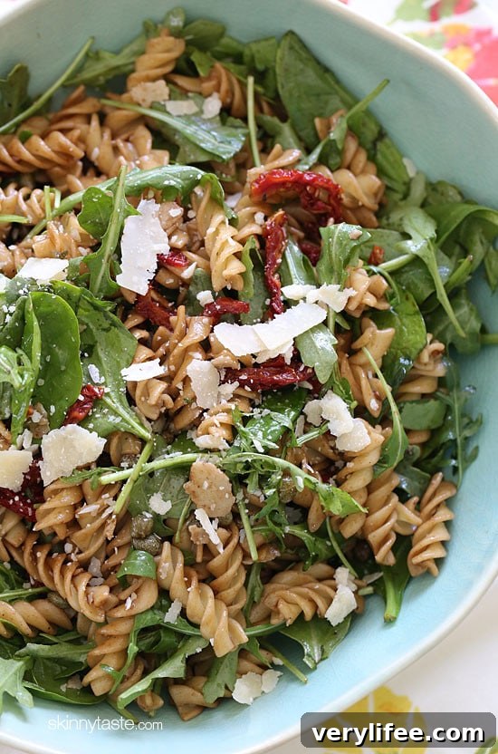 Refreshing Summer Pasta Salad with Baby Greens 2 Mayo-less summer pasta salad with arugula, spinach, sun dried tomatoes, capers and shaved Parmesan