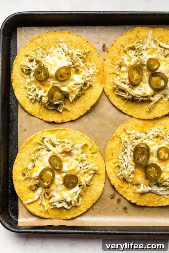 Turn Leftover Chicken Into Salsa Verde Tostadas 8 tostadas with melted cheese out of the oven