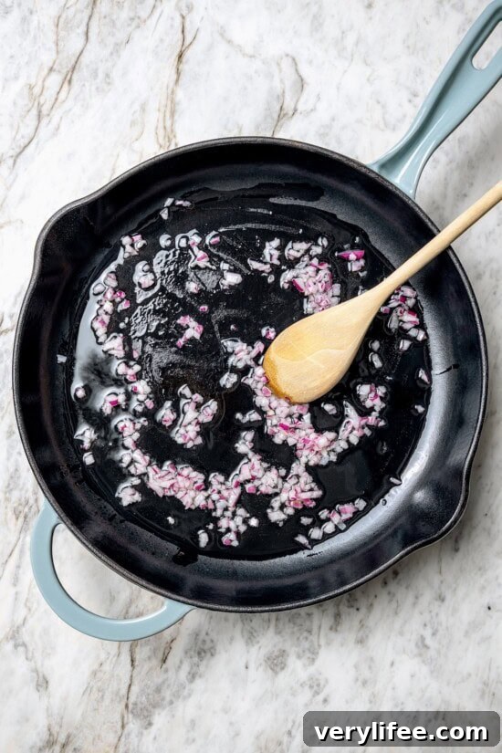 Sauté the onion Cooking red onions in skillet with oil