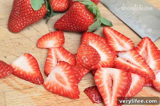 Strawberry Gorgonzola Salad with Creamy Poppy Seed Dressing 4 Strawberry salad made with mixed greens, kale and spinach, sliced almonds, crumbled gorgonzola cheese and topped with poppy seed dressing – perfect for summer!