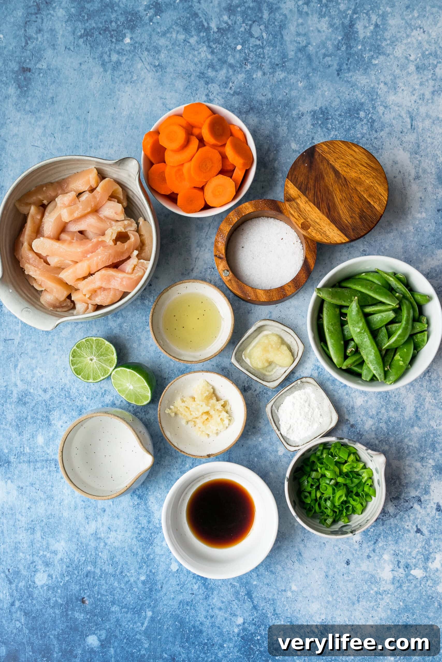 This chicken and vegetable stir fry with snap peas and carrots is sautéed with ginger, lime, and soy sauce. Great for a quick weeknight meal! Chicken and vegetable stir fry ingredients.