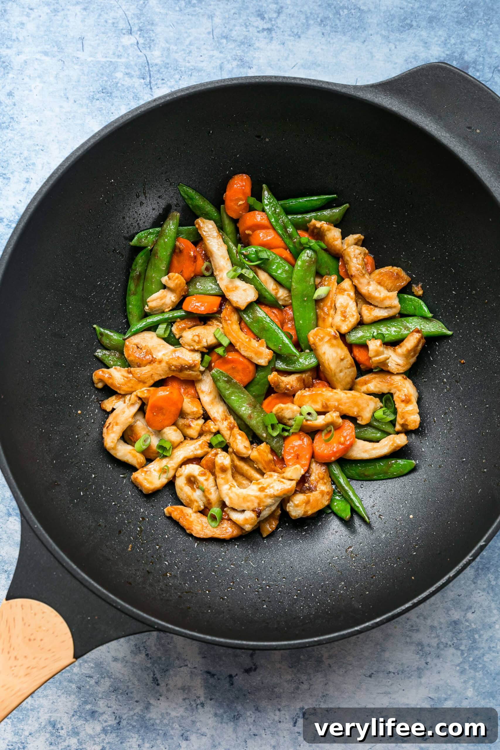 Quick Chicken and Vegetable Stir Fry Recipe 7 Overhead view of chicken and vegetable stir fry in a wok.