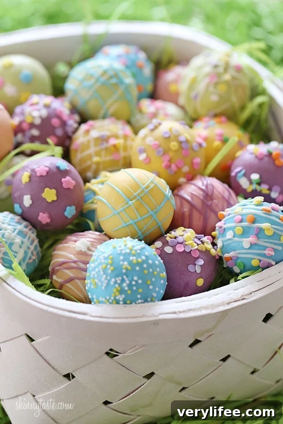 These Easter Egg cake balls are such a fun Easter dessert idea! Made lighter by using a box cake mix, egg whites and fat free Greek yogurt – no oil, no butter required!