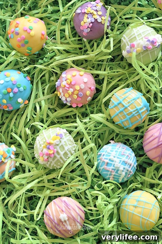 These Easter Egg cake balls are such a fun Easter dessert idea! Made lighter by using a box cake mix, egg whites and fat free Greek yogurt – no oil, no butter required!
