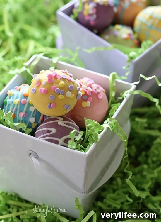These Easter Egg cake balls are such a fun Easter dessert idea! Made lighter by using a box cake mix, egg whites and fat free Greek yogurt – no oil, no butter required!