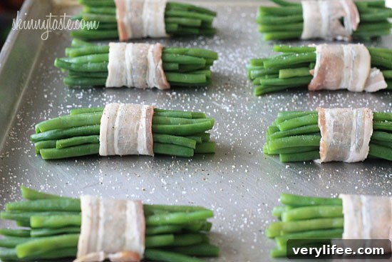 Pretty little bundles of bacon wrapped French 'green beans' known as Haricot verts which are longer and thinner than the typical American green beans. Of course, American green beans will work just fine here too.