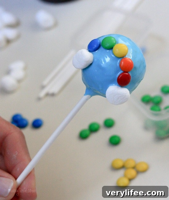 A finished m&m rainbow on the cake pop.