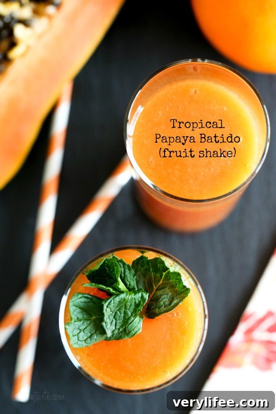 Refreshing papaya batido poured into a glass