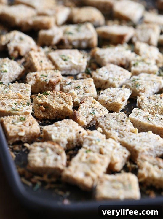 Healthier homemade croutons made with whole grain bread, Italian seasoning and shredded parmesan cheese.