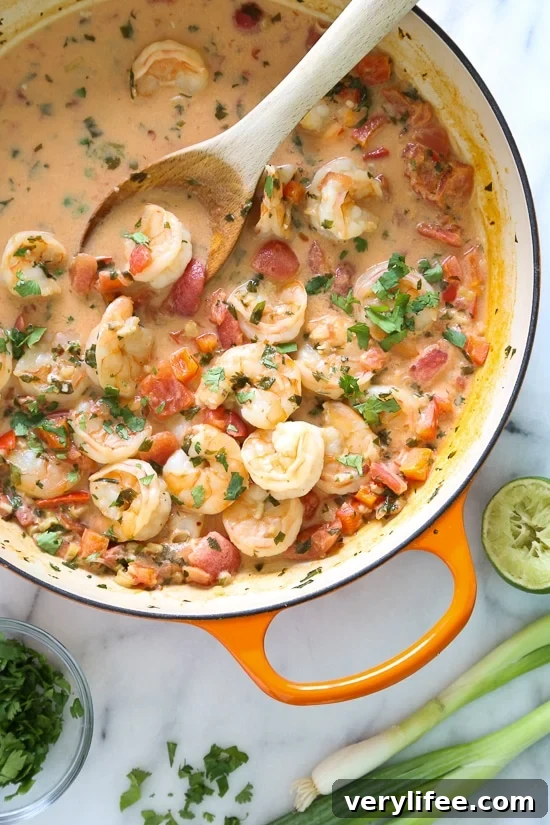 Garlic Shrimp in Coconut Milk with tomatoes and cilantro served over rice