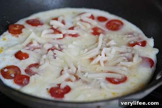 Caprese Egg White Omelet with Tomato and Mozzarella 3 A quick and easy breakfast made with tomatoes, egg whites, mozzarella, and parmesan cheese. Lots of flavor, low in carbs and takes just minutes to make.