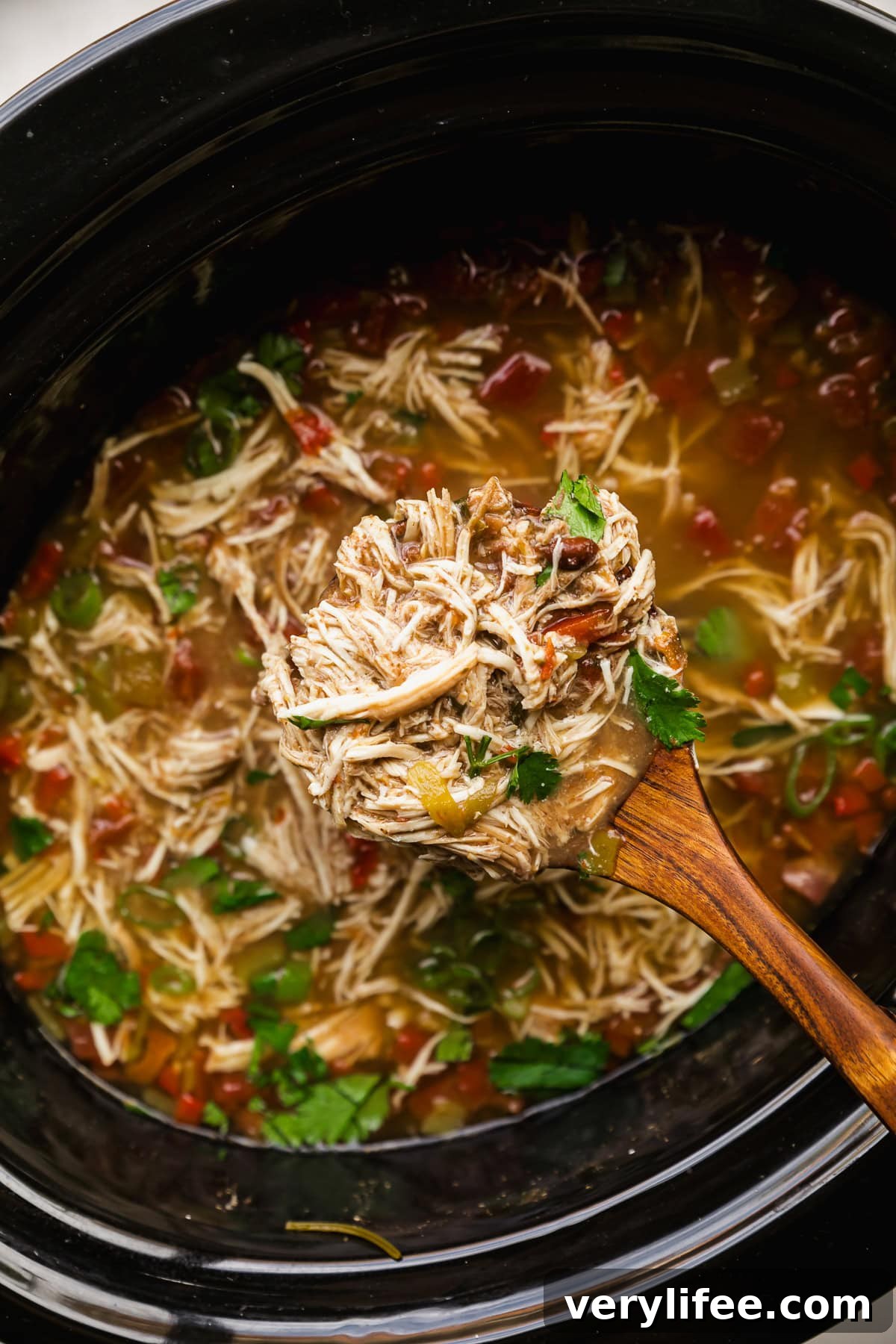 Slow Cooker Chicken and Black Bean Soup 8 Bowl of chicken and black bean soup topped with avocado