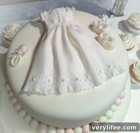 Blood Orange Endive Salad with Citrus Vinaigrette 3 A white cake with a lacy baptism dress, baby shoes, and a rattle