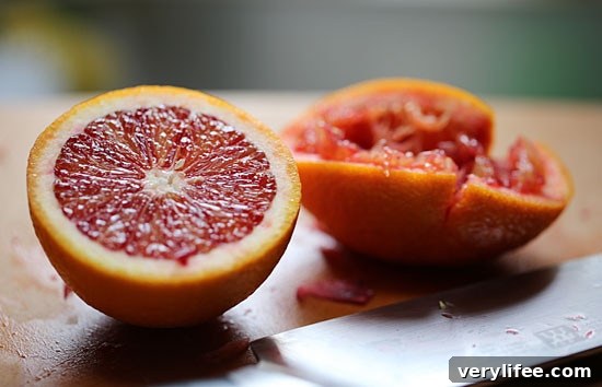 Blood Orange Endive Salad with Citrus Vinaigrette 4 Two halves of a blood orange, with one half squeezed