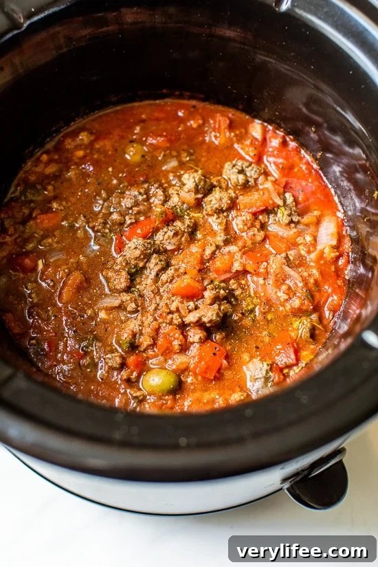 Slow Cooker Picadillo Recipe with Ground Beef 6 Crock Pot Picadillo is a flavorful Cuban dish made with ground beef and a sauce made from simmering tomatoes, green olives, bell peppers, cumin, and spices.