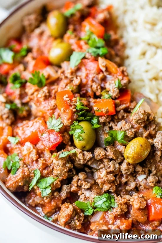 Slow Cooker Picadillo Recipe with Ground Beef 7 Crock Pot Picadillo is a flavorful Cuban dish made with ground beef and a sauce made from simmering tomatoes, green olives, bell peppers, cumin, and spices.