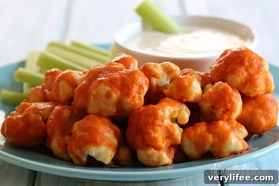 Crispy Spicy Buffalo Cauliflower Bites Recipe 2 Hot and spicy cauliflower bites, battered and baked and smothered with hot sauce. Serve this with skinny blue cheese dressing and celery sticks on the side for a hot and spicy meatless appetizer.