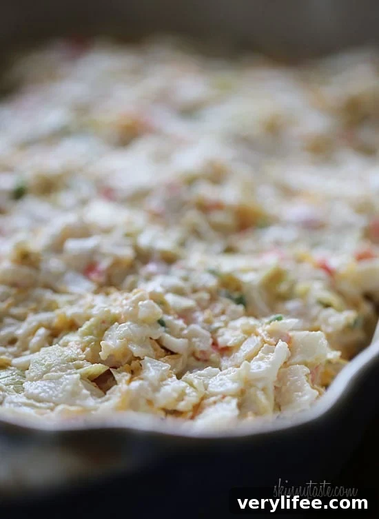 Creamy Baked Crab and Artichoke Dip 5 Hot and cheesy imitation crab and artichoke dip is to die for! Serve this glorious dip with baked chips and you will have the perfect appetizer for any party.