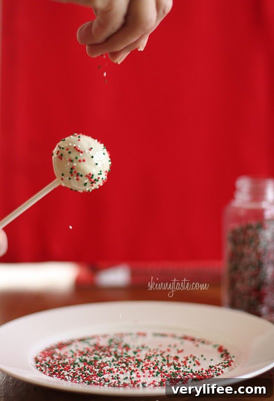 These Skinny Cake pops are made lighter by using a box cake mix, egg whites and fat free Greek yogurt – no oil, no butter required!