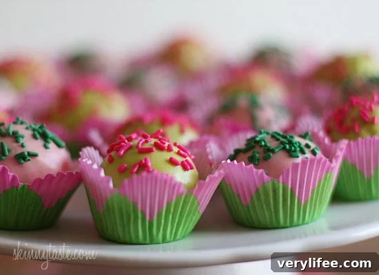 These Skinny Cake pops are made lighter by using a box cake mix, egg whites and fat free Greek yogurt – no oil, no butter required!