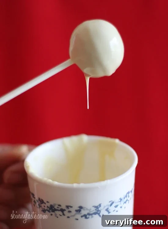 These Skinny Cake pops are made lighter by using a box cake mix, egg whites and fat free Greek yogurt – no oil, no butter required!