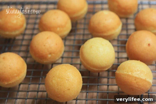 These Skinny Cake pops are made lighter by using a box cake mix, egg whites and fat free Greek yogurt – no oil, no butter required!
