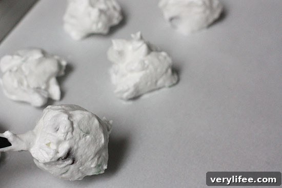 Individual mint chip meringue cookie