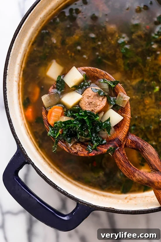 Comforting Kale and Potato Soup with Turkey Sausage Recipe 3 Kale and Potato Soup with Turkey Sausage served in a bowl.