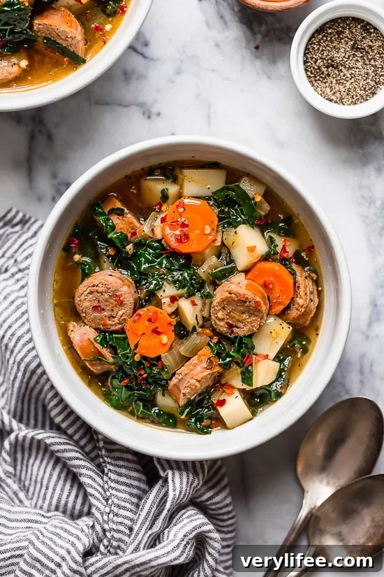 Comforting Kale and Potato Soup with Turkey Sausage Recipe 4 Close-up of Kale and Potato Soup with Turkey Sausage, showing kale and potatoes in broth.