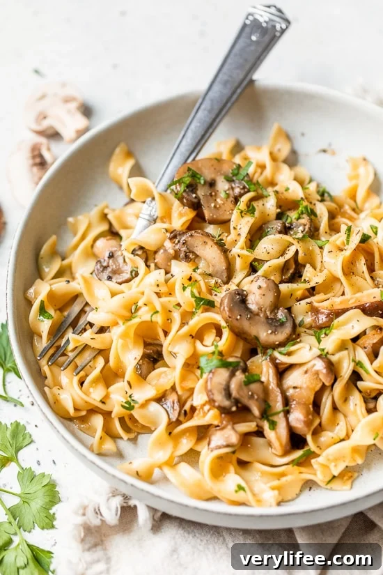 Creamy Mushroom Stroganoff Recipe 3 Mushroom Stroganoff in a plate with a fork.