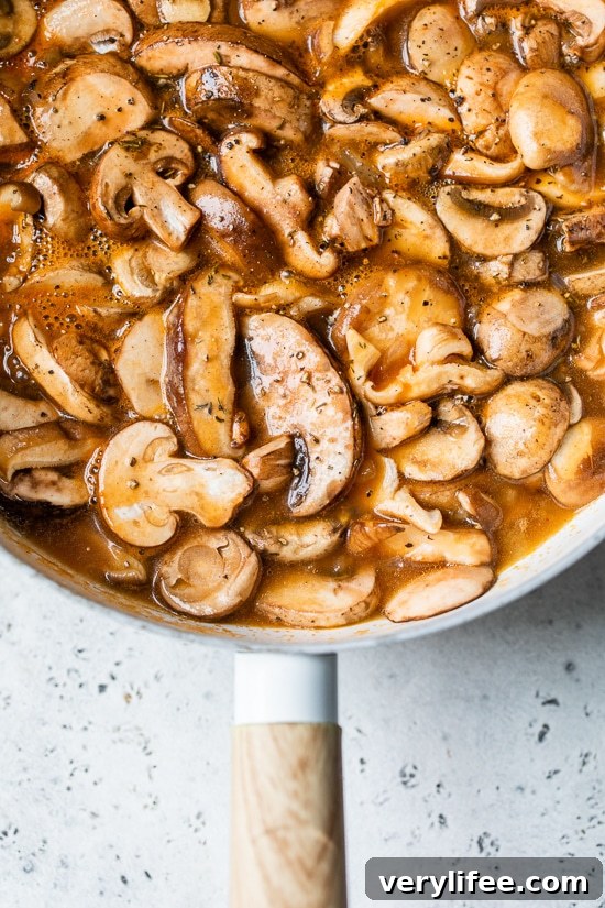 Creamy Mushroom Stroganoff Recipe 4 mushrooms in a skillet