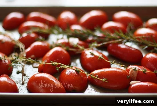 Oven-Roasted Tomatoes with Garlic and Herbs 3 Summer plum tomatoes roasted in the oven with garlic and herbs make an easy, delicious homemade tomato sauce that will fill the room with an intoxicating aroma.