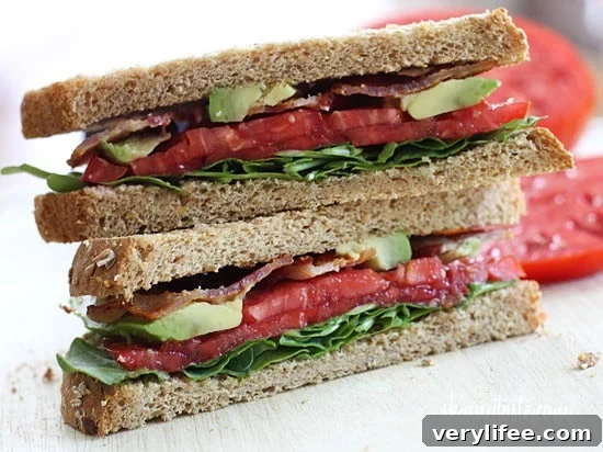 BLT with Avocado sandwich for the bacon lovers in your life! Bacon, lettuce, tomato and avocado on toasted whole grain bread, a quick healthy lunch.
