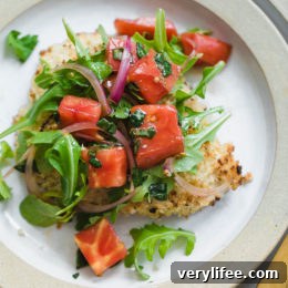 Baked Chicken Milanese is made with breaded chicken cutlets, baked in the oven topped with arugula, tomatoes and balsamic. This is my favorite restaurant dish, made healthier!