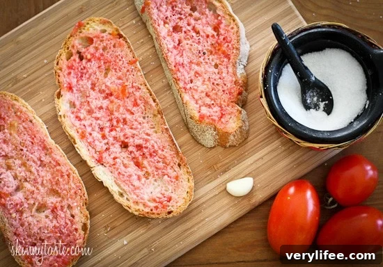 Authentic Spanish Tomato Bread Recipe (Pan con Tomate) 3 Pan con Tomate – rustic slices topped with tomato and olive oil
