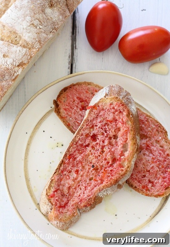 Authentic Spanish Tomato Bread Recipe (Pan con Tomate) 4 Slices of pan con tomate with olive oil and seasoning
