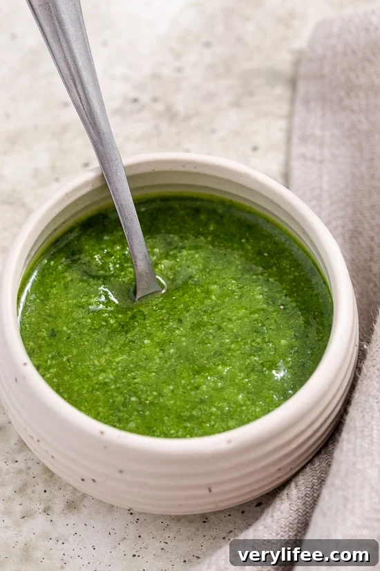 Homemade Basil Pesto in bowl with spoon