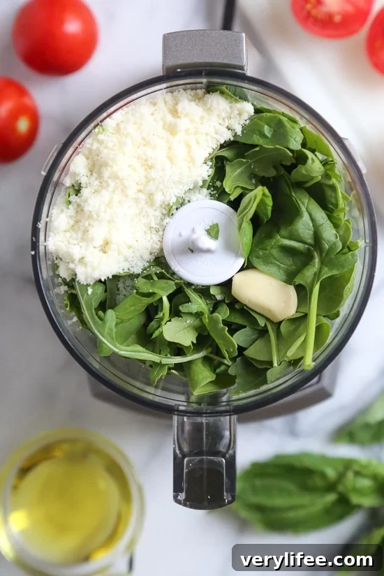 Ingredients for fresh basil pesto in food processor