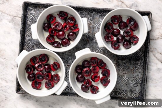 Cherries in 4 ramekins.